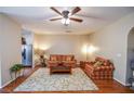 A cozy living room with wood floors, comfortable seating, and natural light creating a warm and inviting atmosphere at 904 Magnolia Leaf Dr, Woodstock, GA 30188