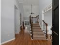 Spacious foyer featuring hardwood floors and a staircase with iron railings at 1514 Haven Crest Dr, Powder Springs, GA 30127
