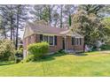 Traditional brick home with front lawn, showcasing its classic design at 1951 Brannen Se Rd, Atlanta, GA 30316