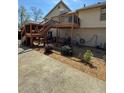 Spacious backyard with a large wooden deck, perfect for outdoor entertaining and relaxation at 321 Roses Creek Dr, Lawrenceville, GA 30044