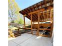 Inviting covered outdoor space with ample seating, ideal for gatherings and enjoying the outdoors at 321 Roses Creek Dr, Lawrenceville, GA 30044