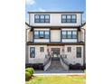 Elegant brick home entrance with stairs leading to a stylish front door at 3905 Danube Ln # 215, Atlanta, GA 30339