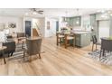 Open-concept living space with views of the modern kitchen and access to staircase at 2876 Wendwood Dr, Marietta, GA 30062
