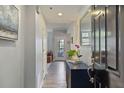 Inviting entryway featuring a console table with decor and a view into the living area at 3636 Habersham Nw Rd # 2103, Atlanta, GA 30305