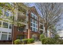 Beautiful brick condo building with balconies and lush landscaping at 3636 Habersham Nw Rd # 2103, Atlanta, GA 30305