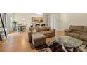 Open-concept living room featuring an adjacent kitchen and dining area at 6389 Shadow Sq, Lithonia, GA 30058