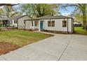 Lovely single-Gathering home with a well-maintained lawn and long concrete driveway at 244 Birch St, Atlanta, GA 30354