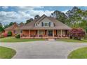 Attractive brick home with a covered front porch, offering curb appeal and charm at 5040 Fawn Valley Dr, Loganville, GA 30052