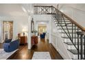 Inviting foyer with hardwood floors, staircase, and access to living spaces at 1285 Wesley Nw Pl, Atlanta, GA 30327