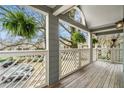 View from cozy balcony with decorative railings, ferns, and a wooden floor at 708 Mcgill Ne Pl, Atlanta, GA 30312
