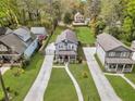 An aerial view captures a charming two-story home with well-manicured lawn at 3117 Dogwood Dr, Hapeville, GA 30354