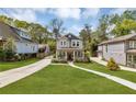 Charming two-story home featuring a welcoming front porch and well-manicured lawn at 3117 Dogwood Dr, Hapeville, GA 30354
