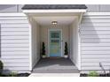 Charming home entrance with a light blue door, modern house number, and manicured landscaping at 1251 Pierce Se Ave, Smyrna, GA 30080