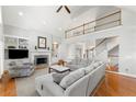 Spacious living room with high ceilings, fireplace, built-ins, and hardwood floors at 2283 Edgemere Lake Cir, Marietta, GA 30062