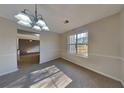 Bright dining room with large windows and elegant chandelier, perfect for Gathering meals at 4688 Snap Creek Ln, Decatur, GA 30035