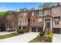 Charming brick townhome with manicured landscaping and a private two-car garage at 1453 Montclair Se Ct # 26, Smyrna, GA 30080