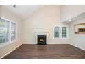 An inviting living room featuring high ceilings, hardwood floors and a cozy fireplace at 1946 Glenwood Downs Dr, Decatur, GA 30035