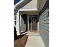 Welcoming front entrance featuring a stylish door with decorative wreath and adjacent window at 63 Aspen Way, Dallas, GA 30157