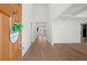 Bright foyer featuring hardwood floors, soaring ceilings, and a view into the open-concept living spaces at 6710 Grayland Dr, Douglasville, GA 30135