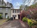 Inviting two-story townhouse with landscaped yard and close proximity to neighboring units at 3839 Henry Ct, Acworth, GA 30101