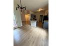 Eat-in kitchen with modern island, granite counters, stainless appliances and wood floors at 5760 Old Carriage Dr, Atlanta, GA 30349