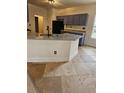 This kitchen features granite countertops, an island with a sink, and updated appliances, offering style and functionality at 5760 Old Carriage Dr, Atlanta, GA 30349