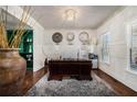 Sophisticated home office featuring a large desk, unique decor, hardwood floors, and custom built-ins at 3308 Pate Rd, Snellville, GA 30078