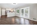 Open dining area with wood floors and doors to the backyard at 5052 W Mountain St, Stone Mountain, GA 30083