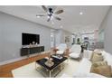Bright living room with hardwood floors, ceiling fan, and modern furnishings at 1857 Derrill Dr, Decatur, GA 30032