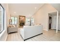 Cozy living room with stone fireplace, bright windows and hardwood floors at 4579 Glenforest Ne Dr, Roswell, GA 30075