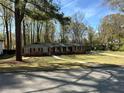 Well-maintained brick home with green lawn and mature trees in a desirable location at 4063 Windsor Castle Way, Decatur, GA 30034