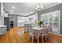 Spacious kitchen with granite countertops, modern appliances, and adjacent breakfast area for casual dining at 5729 Brookstone Nw Walk, Acworth, GA 30101
