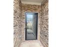Inviting front door framed by attractive stone veneer, offering a warm welcome at 6125 Langdon Way, Cumming, GA 30028