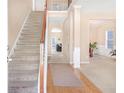 Bright foyer with staircase and hardwood floors, leading to the living spaces in the home at 3642 Sunbridge Dr, Snellville, GA 30039