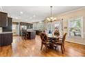 Open kitchen with an island, stainless appliances, and a breakfast area at 1460 Edgemont Pt, Lawrenceville, GA 30044