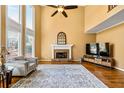 Spacious living room with tall windows, fireplace, and neutral tones at 1460 Edgemont Pt, Lawrenceville, GA 30044