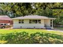 Charming, one story home with a well-maintained lawn and a driveway leading to the house at 732 Quaker Sw St, Atlanta, GA 30315
