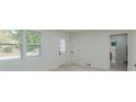 Bright living room area with new laminate floors and lots of windows at 1956 Washington Rd, East Point, GA 30344
