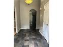 Hallway with tiled floor that leads to the kitchen and the living spaces at 3415 Camens Ct, Buford, GA 30519