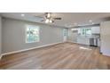 Spacious open-concept living and kitchen area with new flooring and modern finishes at 3650 Clovis Nw Ct, Atlanta, GA 30331