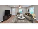 Inviting living room with neutral tones, stylish furniture, and ample natural light at 3650 Clovis Nw Ct, Atlanta, GA 30331