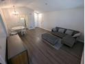 The spacious living room has new wood floors, and neutral colors at 434 Bentley Place, Tucker, GA 30084