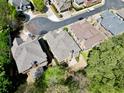 An aerial view displays the property, with its gray roof, nestled among other houses in a well-established neighborhood at 4782 Lakeway, Alpharetta, GA 30005