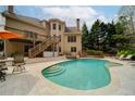 Beautiful backyard with a swimming pool, wooden deck, and access stairs at 4981 Millwood Dr, Canton, GA 30114