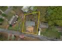 Aerial view of a property surrounded by green trees, showing approximate property lines at 7535 Asbury Dr, Riverdale, GA 30274
