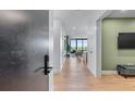 Hallway leading to an open living space with hardwood floors at 2425 Peachtree Ne Rd # 1211, Atlanta, GA 30305