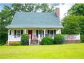 Charming home with a welcoming porch and well-maintained lawn at 3545 Liberty Rd, Villa Rica, GA 30180