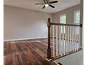 Bright and spacious living area featuring hardwood floors, neutral walls, and a ceiling fan at 4232 Chickasaw Trl, Douglasville, GA 30135