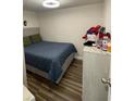 Cozy bedroom with a comfortable bed, hardwood floors, and ample natural light at 120 Valley Dr, Loganville, GA 30052