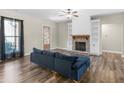 Cozy living room with a fireplace, built-in shelving, hardwood floors, and a comfortable sofa at 1847 Davis Mill Rd, Dallas, GA 30157